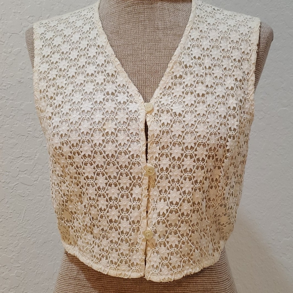 Cream, lace vest blouse, lined with buttons.